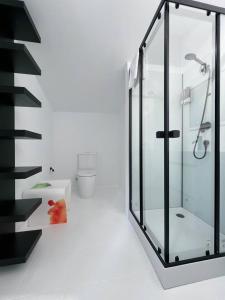 a bathroom with a glass shower and a toilet at Cabanas da Auga in Ures +40 photos