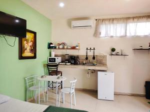 a kitchen with a table and chairs in a room at Martha Cozy Apartments 2 in Valladolid