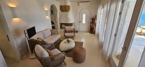 a living room with a couch and chairs at Villa Achilleas Crete in Ierapetra