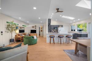 a kitchen and living room with a couch and a table at Seal Cove in Lilliwaup