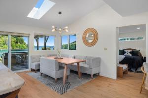 a living room with a table and a couch at Seal Cove in Lilliwaup