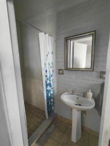 a bathroom with a sink and a shower at Uncle Charlie in Kroonstad