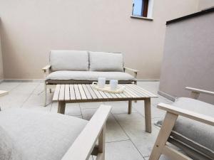 a living room with a couch and a coffee table at Domus Soli in Teulada