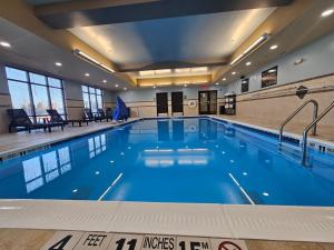 a large swimming pool in a building at Hampton Inn Potsdam, NY in Potsdam