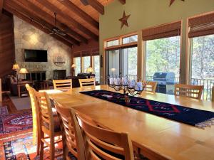 a dining room with a large wooden table and chairs at 6 Colonial Lane in Sunriver