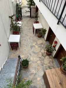 an overhead view of a patio with tables and potted plants at Lokal Ayvalık Guest House in Ayvalık +13 photos