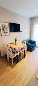 a living room with a table and chairs and a couch at 50 Special in Pontedera