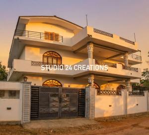 a building with a sign that reads studio creations at Vish Homes in Nallur +17 photos