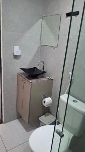a bathroom with a sink and a toilet at Flat 205 Zuppolini in Bananeiras