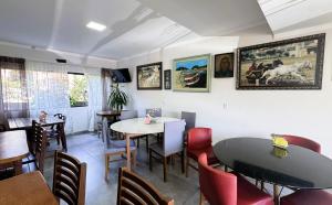 a dining room with a table and chairs at Pousada Castelo do Rei in Penha