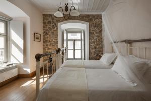 Llit o llits en una habitació de Allegra Heritage Mansion
