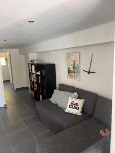 a living room with a couch and a book shelf at villa rêve in Calvi +9 photos