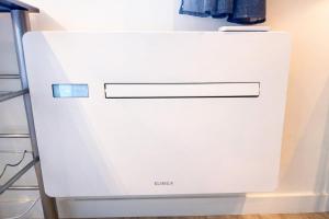 a white refrigerator freezer sitting in a kitchen at Studette au centre des marina- smart in Villeneuve-Loubet