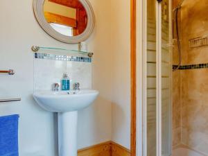a bathroom with a sink and a shower at 3 Bed in Crieff oc-88631 in Comrie +16 photos