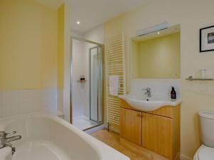 a bathroom with a tub and a sink and a toilet at 5 Bed in Aberlour oc-ca280 in Carron +26 photos