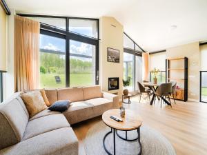a living room with a couch and a table at Amsterdam in Oud-Ade