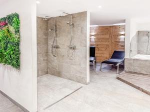 a bathroom with a shower and a sink at Apartment Lotus in Ovronnaz +24 photos