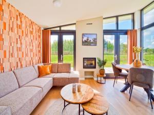 a living room with a couch and a table at Leiden in Oud-Ade