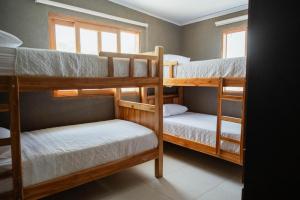 a room with three bunk beds and a window at Mykonos Beach House Apartamentos By Jerusalema in Tolú +23 photos