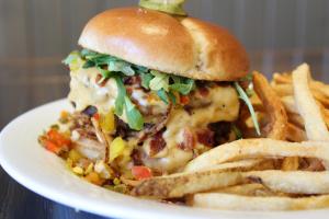 a plate of food with a sandwich and french fries at The Fredericton Inn in Fredericton