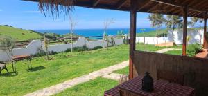 a view of the ocean from a house with a table at Darna 2 in Demina +19 photos