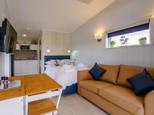 a living room with a couch and a bed at 1 Bed in Girvan oc-78072 in Girvan