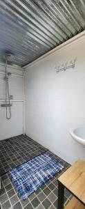 a bathroom with a tub and a sink and a toilet at La tente de Cléa in Salazie