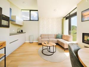 a living room with a couch and a table at Polder in Oud-Ade
