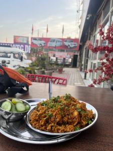 a plate of food sitting on a table at WAYNEST by SHELTERS in Meppādi
