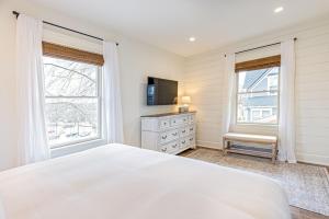 a bedroom with a white bed and two windows at Kildahl House - Boutique Farmhouse Suite #3 in West Dundee +14 photos