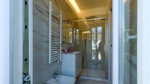 a bathroom with a toilet and a sink and a shower at BORGO MARE 86 rooms in Porto SantʼElpidio +51 photos