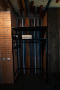 a book shelf filled with books in a room at Loft & SPA resort ROOMs in Palyanytsya +2 photos