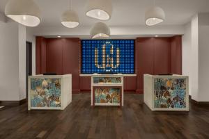 a room with two counters with a clock on the wall at The Westshore Grand, Tampa, A Tribute Portfolio Hotel in Tampa