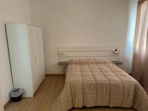a bedroom with a large bed in a room at Hotel 31 in Limena