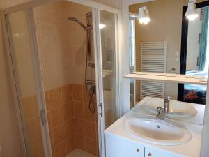 a bathroom with a sink and a shower at Le Relais du Jardin in Orbigny +10 photos