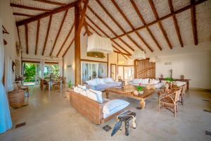 a large living room with couches and a table at Casa Mandala Corumbau in Corumbau +37 photos