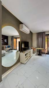 a living room with a couch and a table at مجموعة سدرة فاطمة in Al Ahsa
