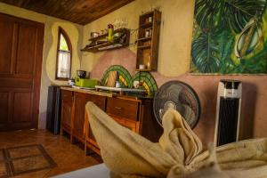 a kitchen with a sink and a fan at Montezuma Heights in Montezuma