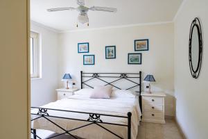 a bedroom with a bed and a ceiling fan at Villa Claudia - YourPlace Abruzzo in Termoli