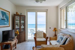 a living room with a view of the ocean at Villa Claudia - YourPlace Abruzzo in Termoli