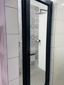 a shower with a glass door in a bathroom at Redem House in Modimolle +37 photos