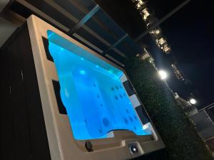 a tv screen with a blue light on a stage at Coral Nikiti Apartments I in Nikiti