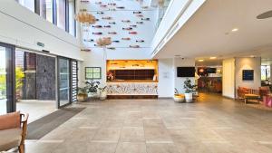 a lobby of a building with shoes on the ceiling at Tropical - Resort - Spa - Pool & Garden in Grand-Baie +41 photos