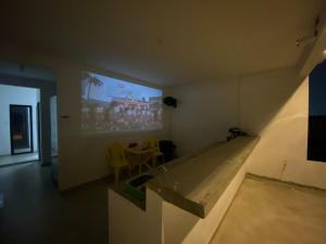a room with a projection screen on the wall at Apartamento Tercer Cielo 202 in Cúcuta
