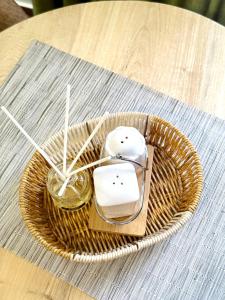 a wicker basket with a computer mouse and a candle at The Reset Stay in Kampala