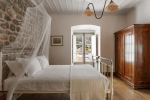 Llit o llits en una habitació de Allegra Heritage Mansion