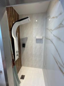 a bathroom with a shower with a glass door at Bela vista AL in Paredes de Coura +64 photos