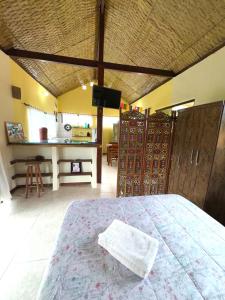 a bedroom with a bed and a tv in a room at Loft com vista Panoramica in Paraty