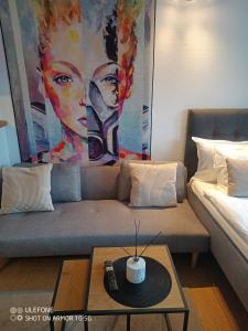a living room with a couch and a coffee table at North Home in Skellefteå