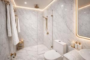 a white bathroom with a shower and a toilet at Old Yerevan by IGIT in Yerevan +60 photos
